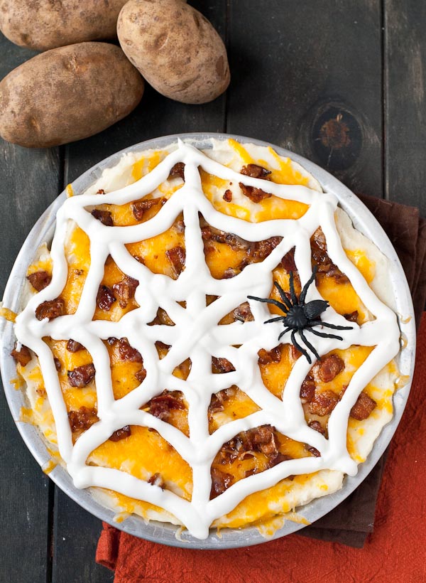 This Creamy Loaded Mashed Potato Casserole is ready to add some spook to your Halloween party!