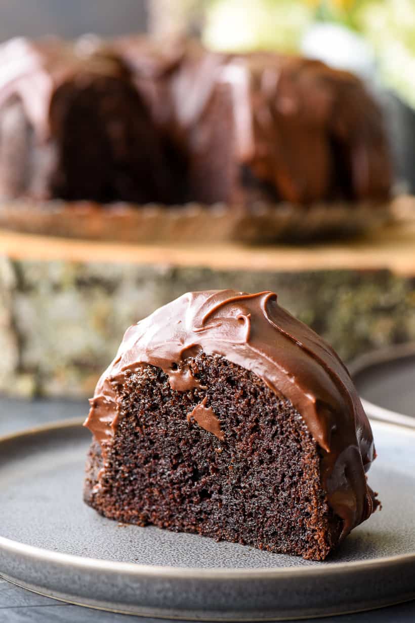 Single slice of a moist chocolate cake recipe with sour cream frosting
