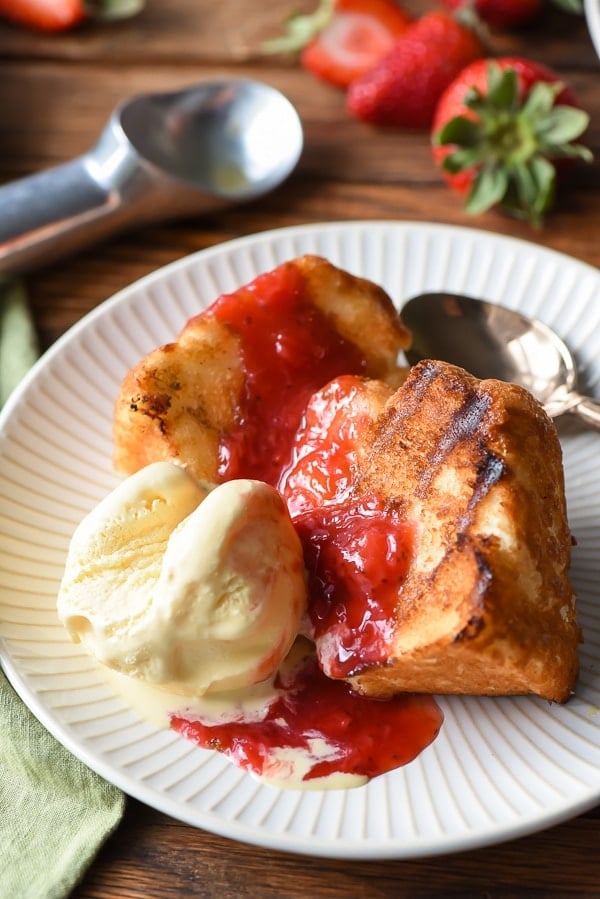 Grilled Angel Food Cake slice with strawberries and ice cream