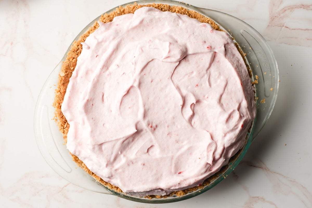 Graham cracker crust filled with strawberry mousse.