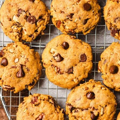 Chewy Pumpkin Chocolate Chip Cookies on a circular wire cooling rack.