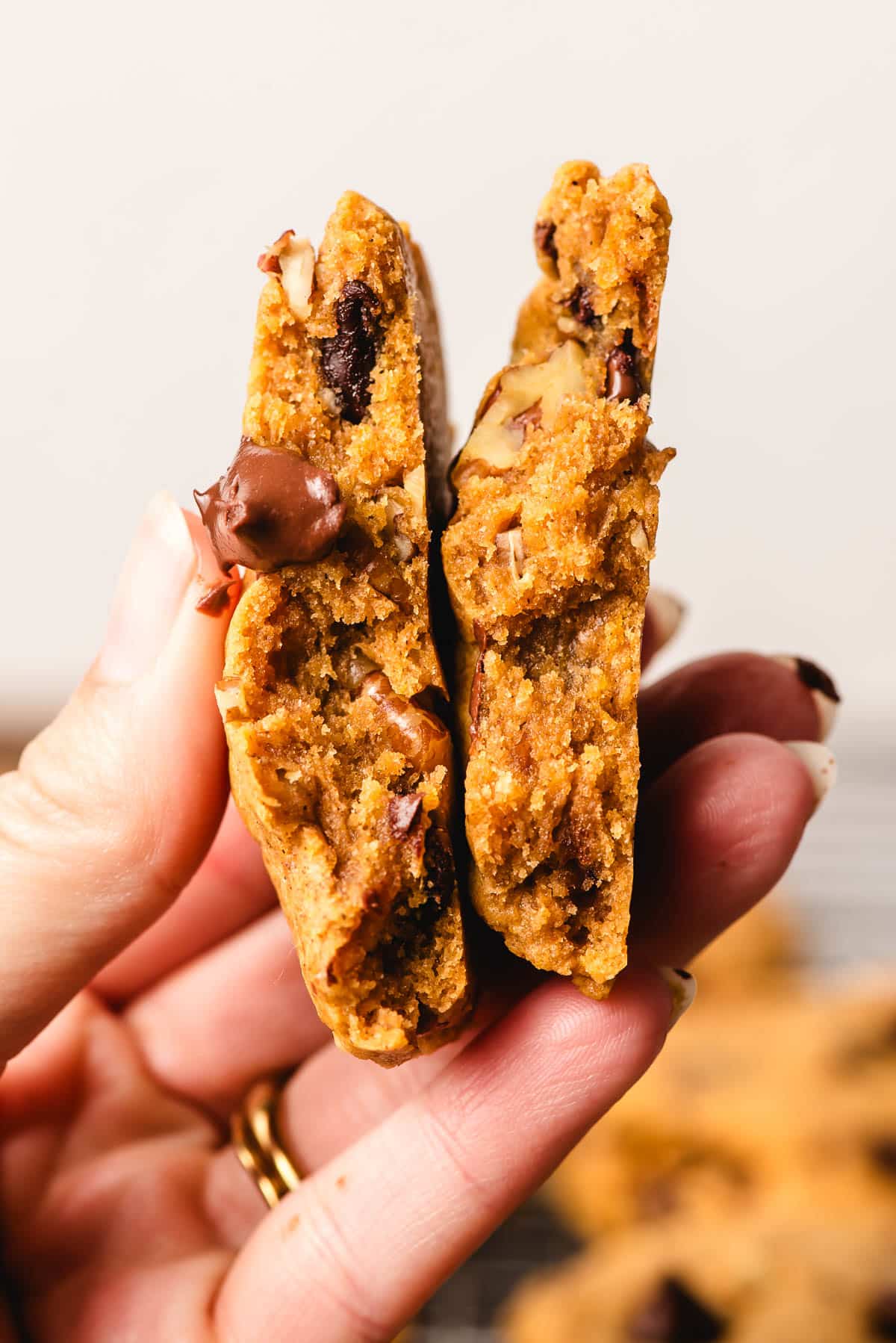 Pumpkin chocolate chip cookie, halved, to show the chewy interior.