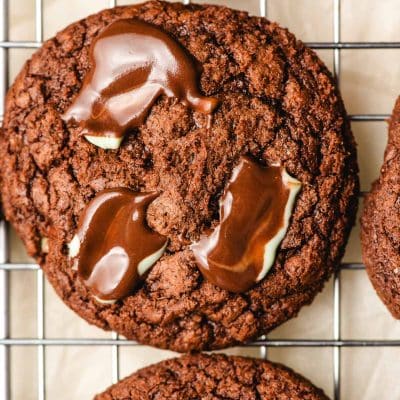 Andes mint brownie cookie sitting on a cooling rack.