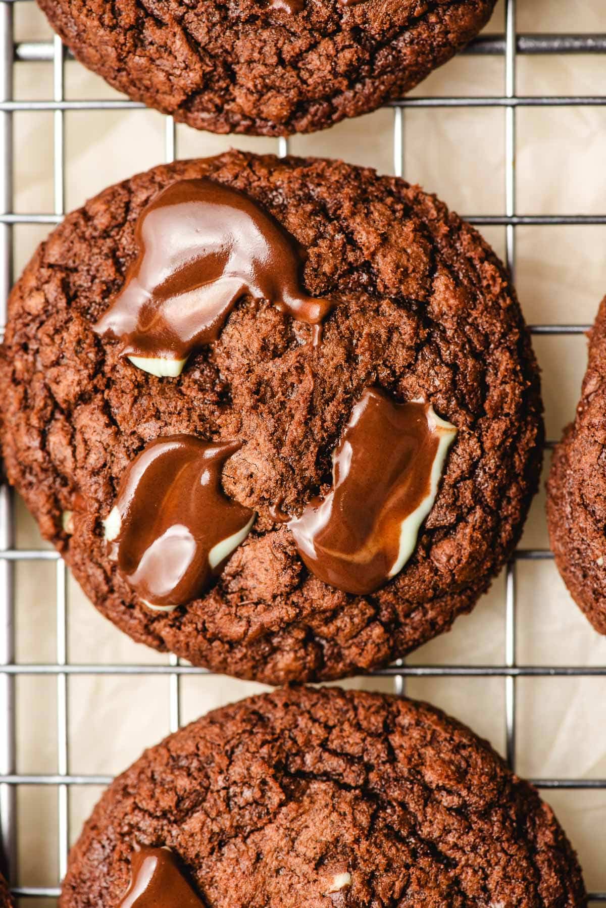 Andes mint brownie cookie sitting on a cooling rack.
