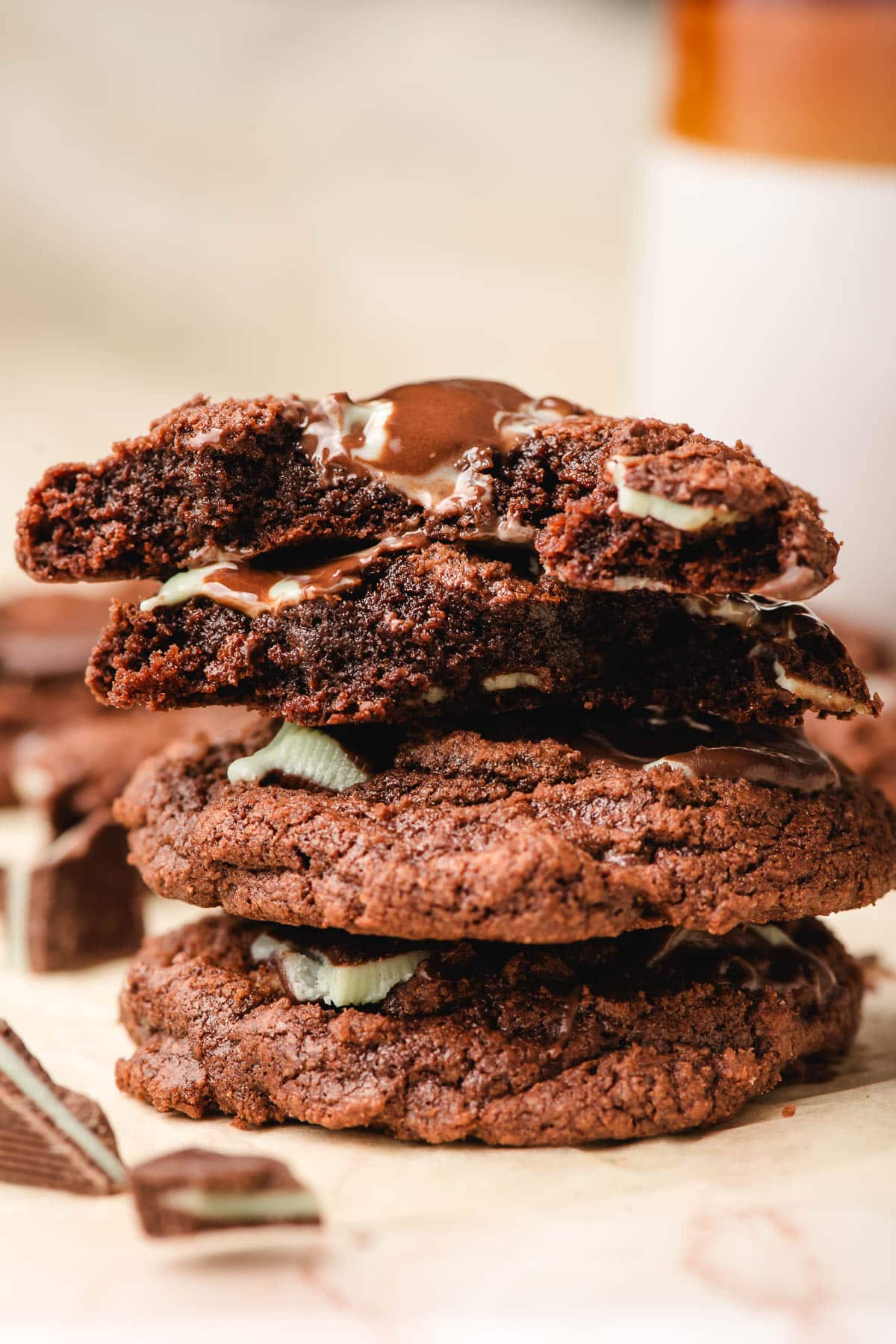 Stack of Andes Mint Chocolate Cookies, with one halved so you can see the fudgy interior.
