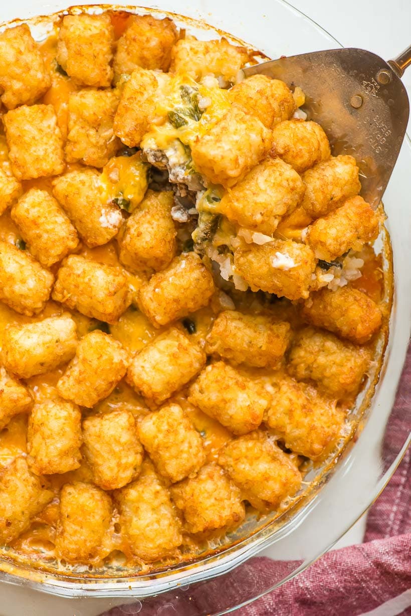 Tater Tot Casserole with Green Beans in a glass pie plate