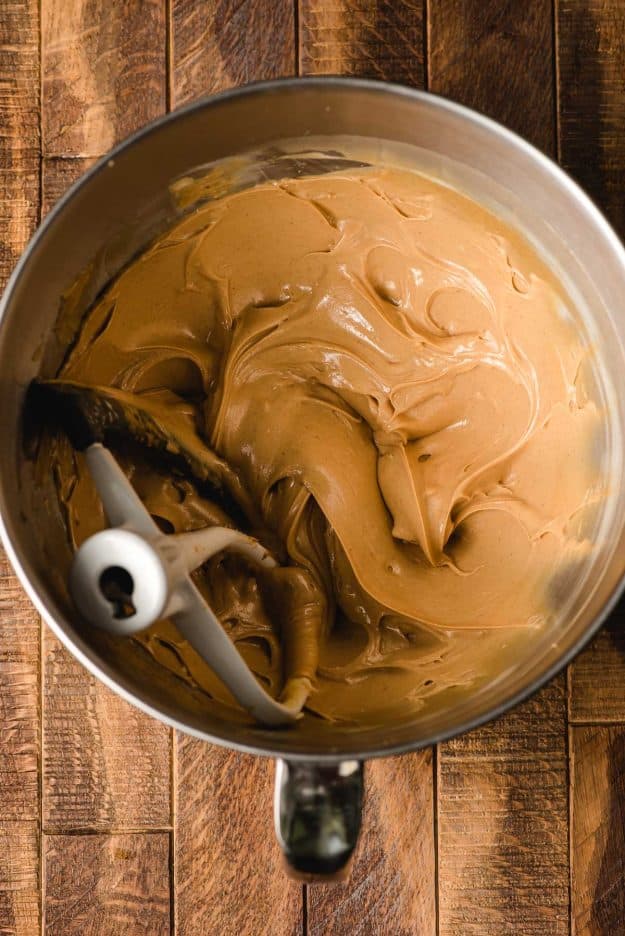 Peanut butter and butter beaten together in a mixing bowl.