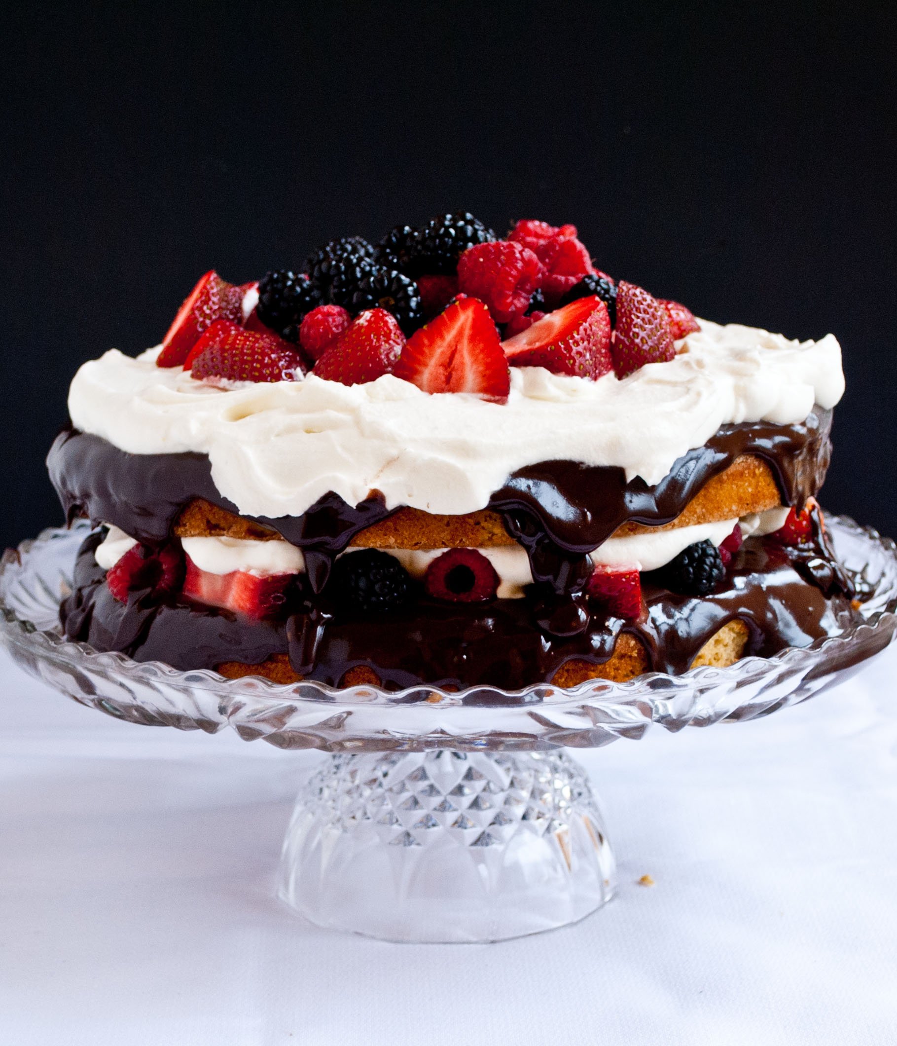 Gluten Free Coconut Cake with Fresh Berries, Ganache, and Whipped Cream | Neighborfoodblog.com