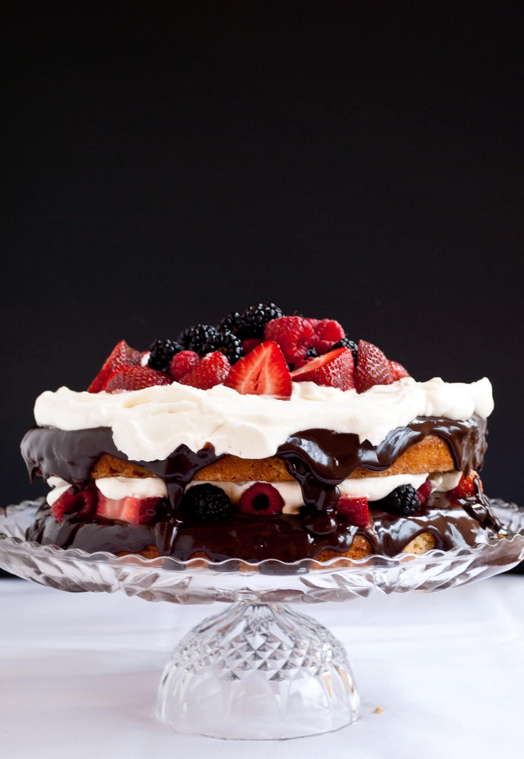 Gluten Free Coconut Cake with Fresh Berries, Ganache, and Whipped Cream | Neighborfoodblog.com