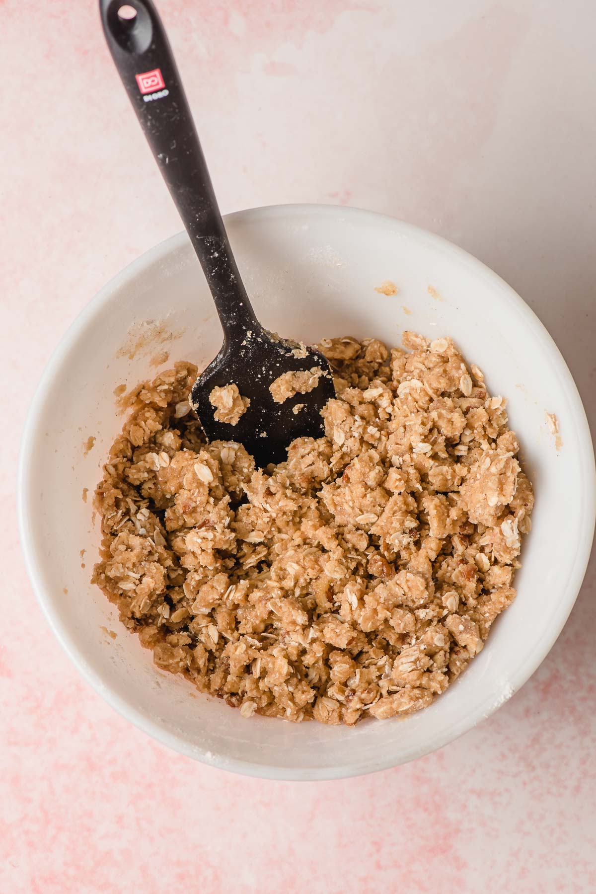 Buttery crumb topping in a white mixing bowl.