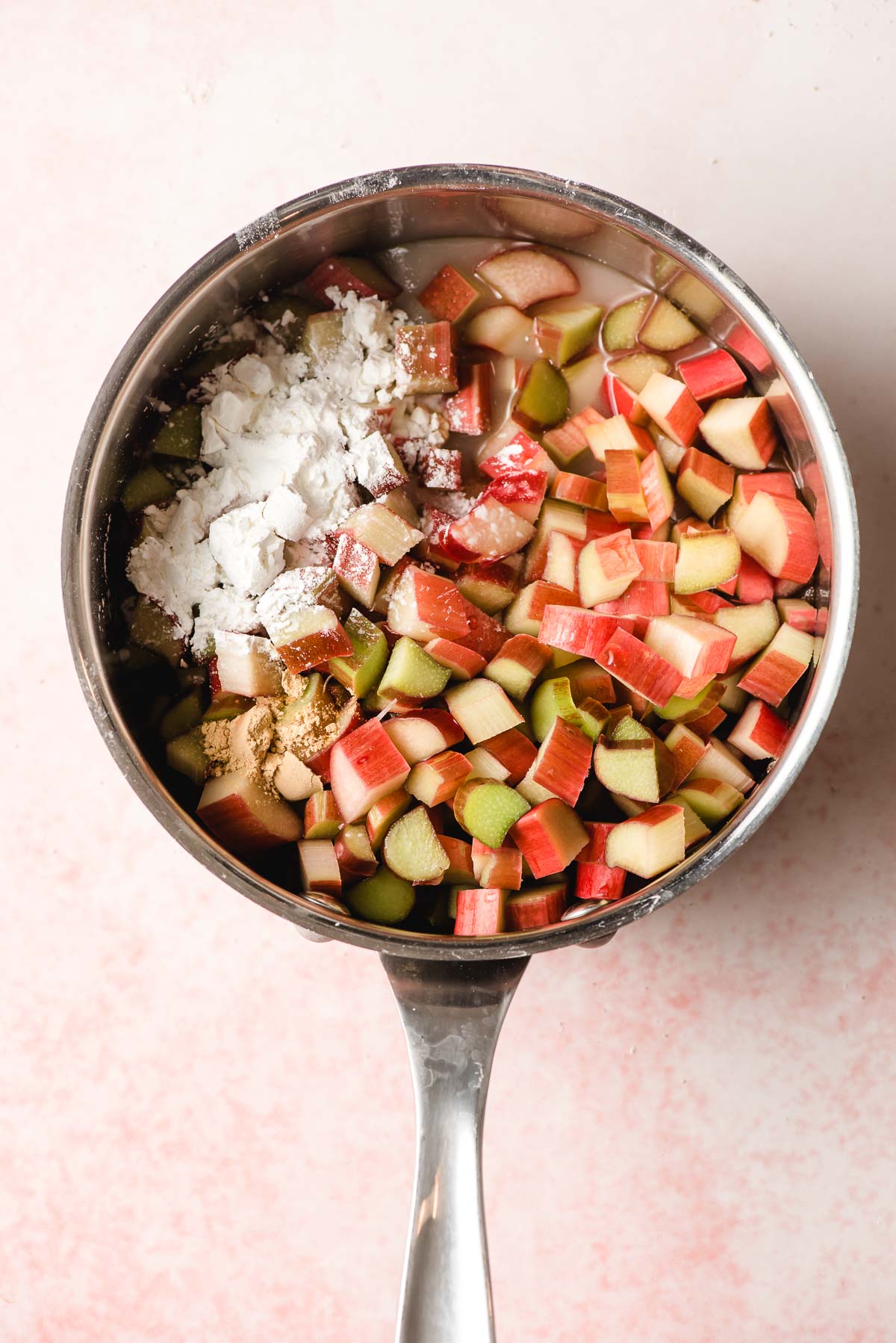 Sauce pan with chopped rhubarb, cornstarch, and sugar.