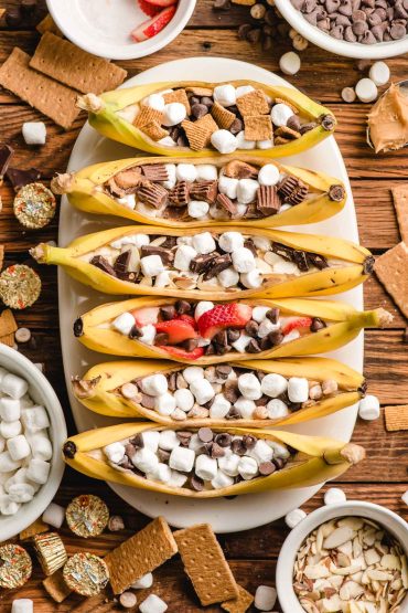 Six bananas, sliced down the middle to form a boat, then stuffed with marshmallows and chocolate.