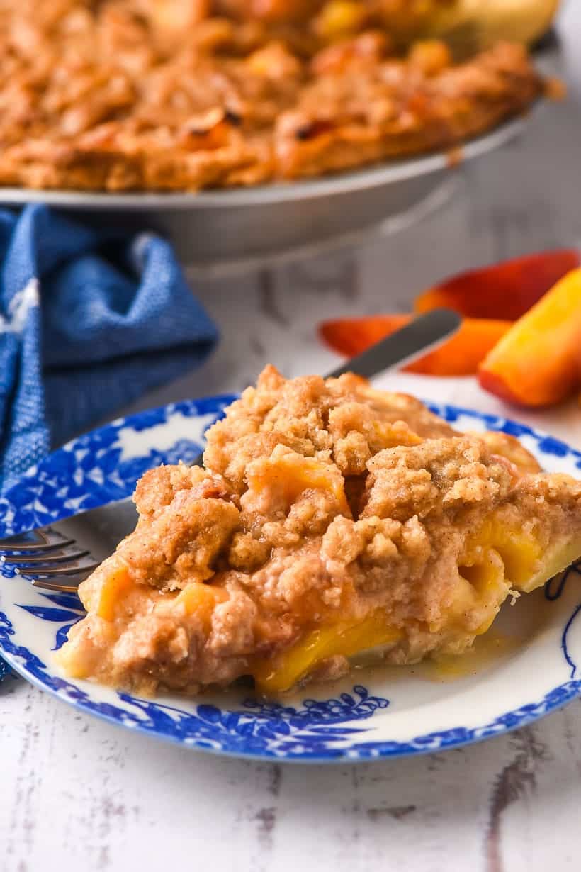 slice of peach crumble pie