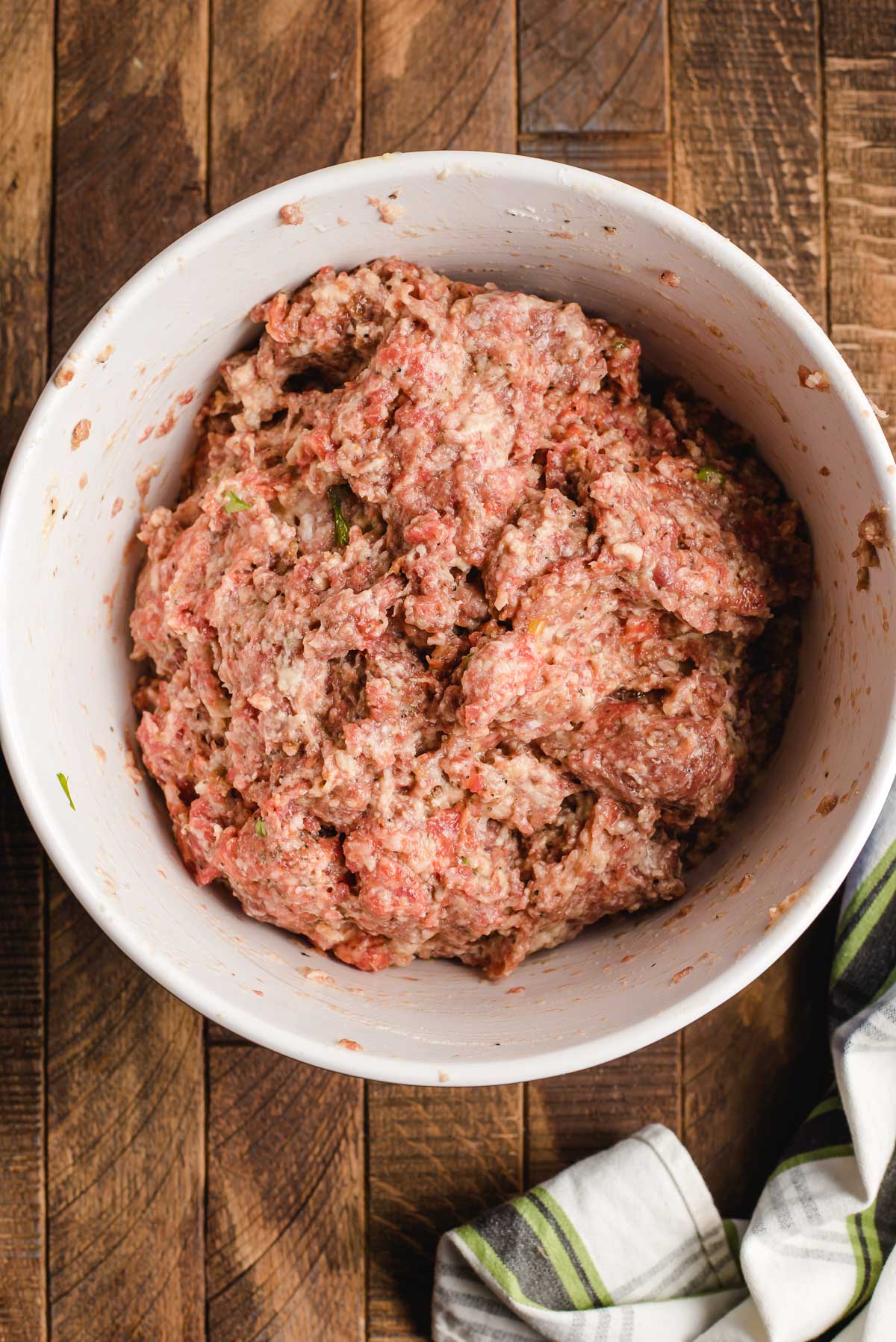 Meat mixture for homemade meatballs in a bowl.
