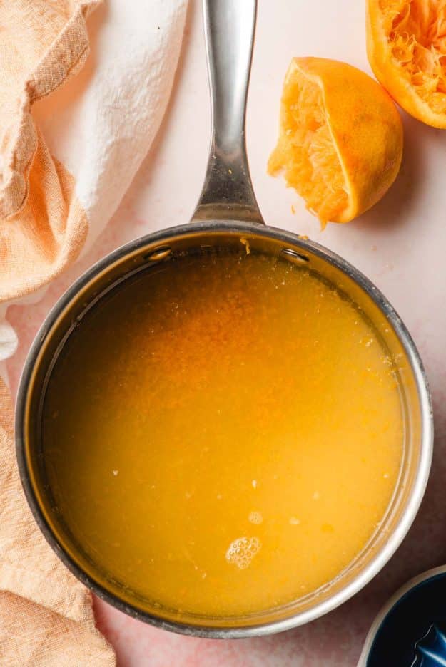 Water, orange juice, orange zest, and sugar in a sauce pan.