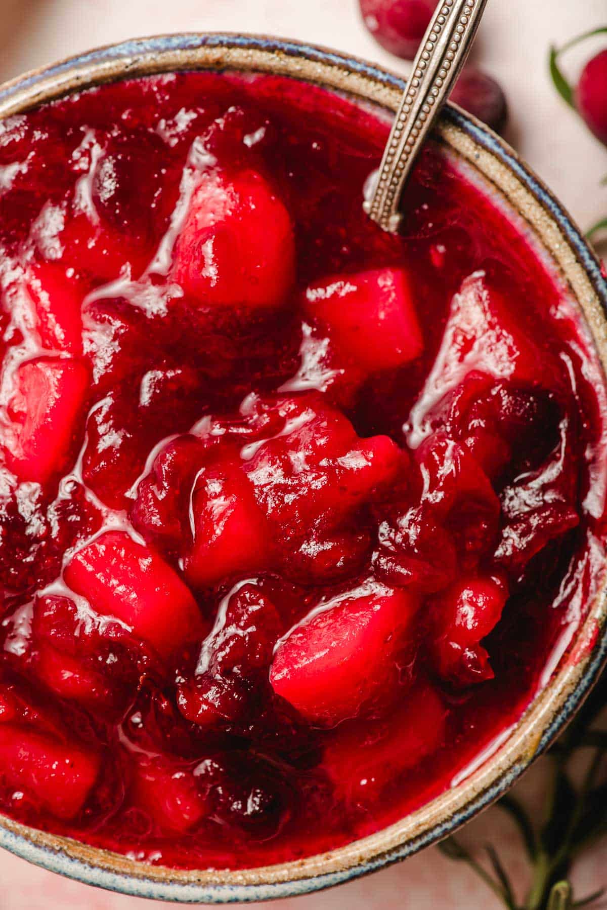 Pear and cranberry sauce in a pottery bowl.