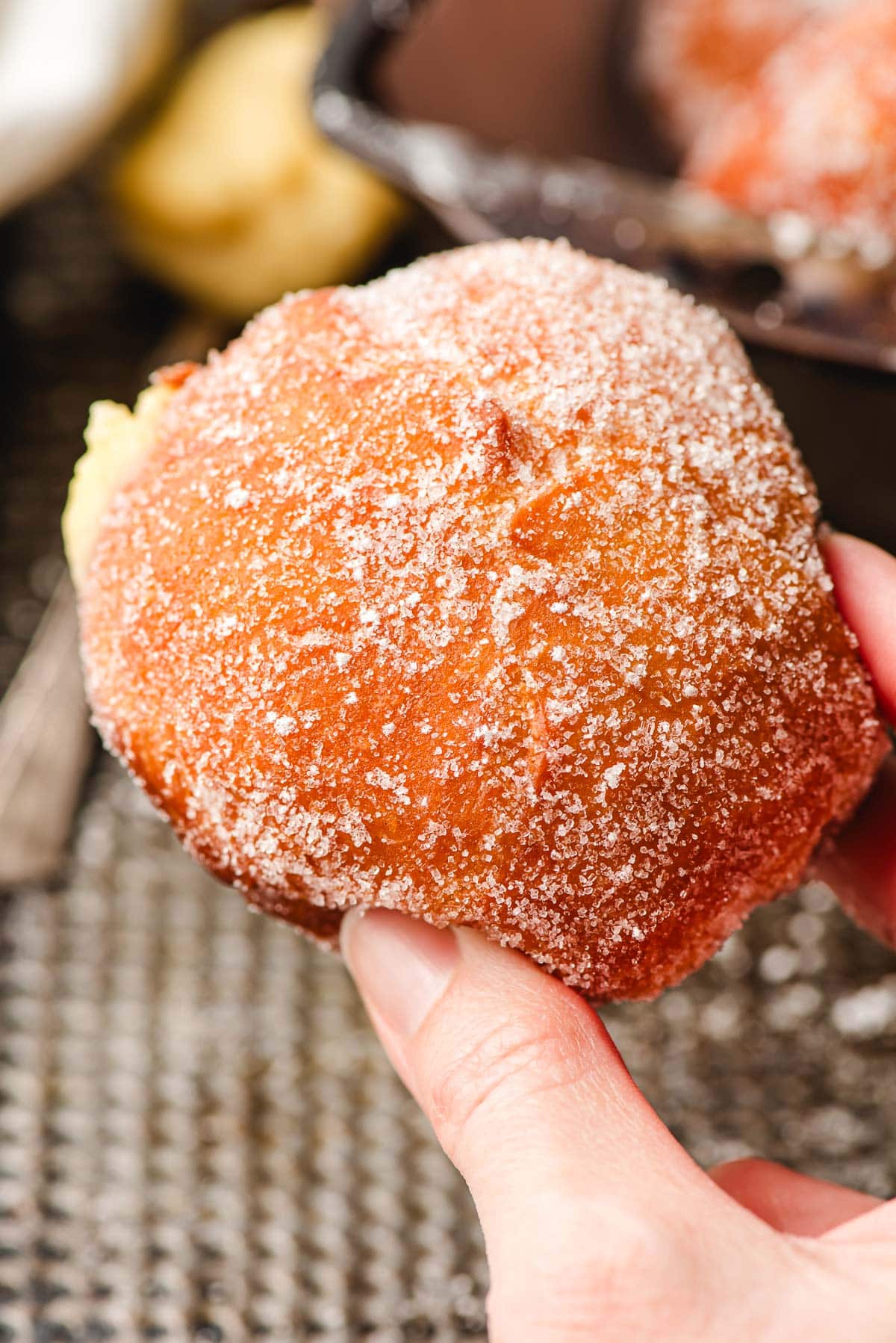 Custard filled paczki covered in sugar