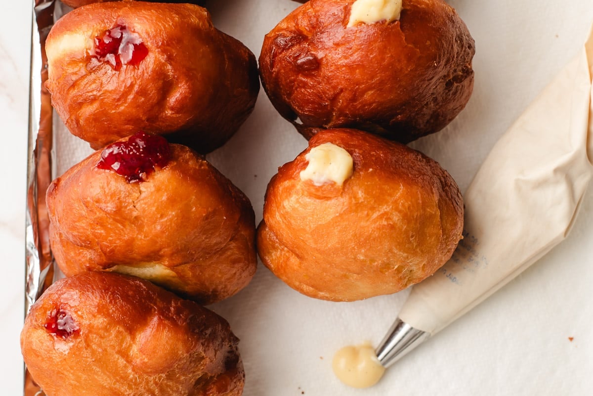 Custard and strawberry filled paczki.