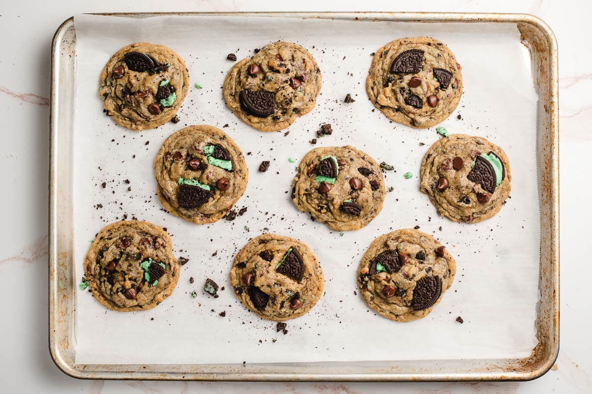Baked Mint Oreos Chocolate Chip Cookies on a baking sheet.