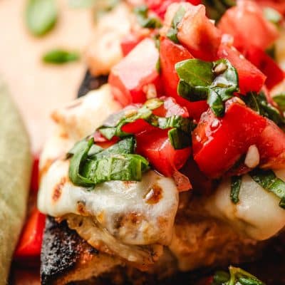 French bread topped with mozzarella cheese, chicken, and bruschetta.