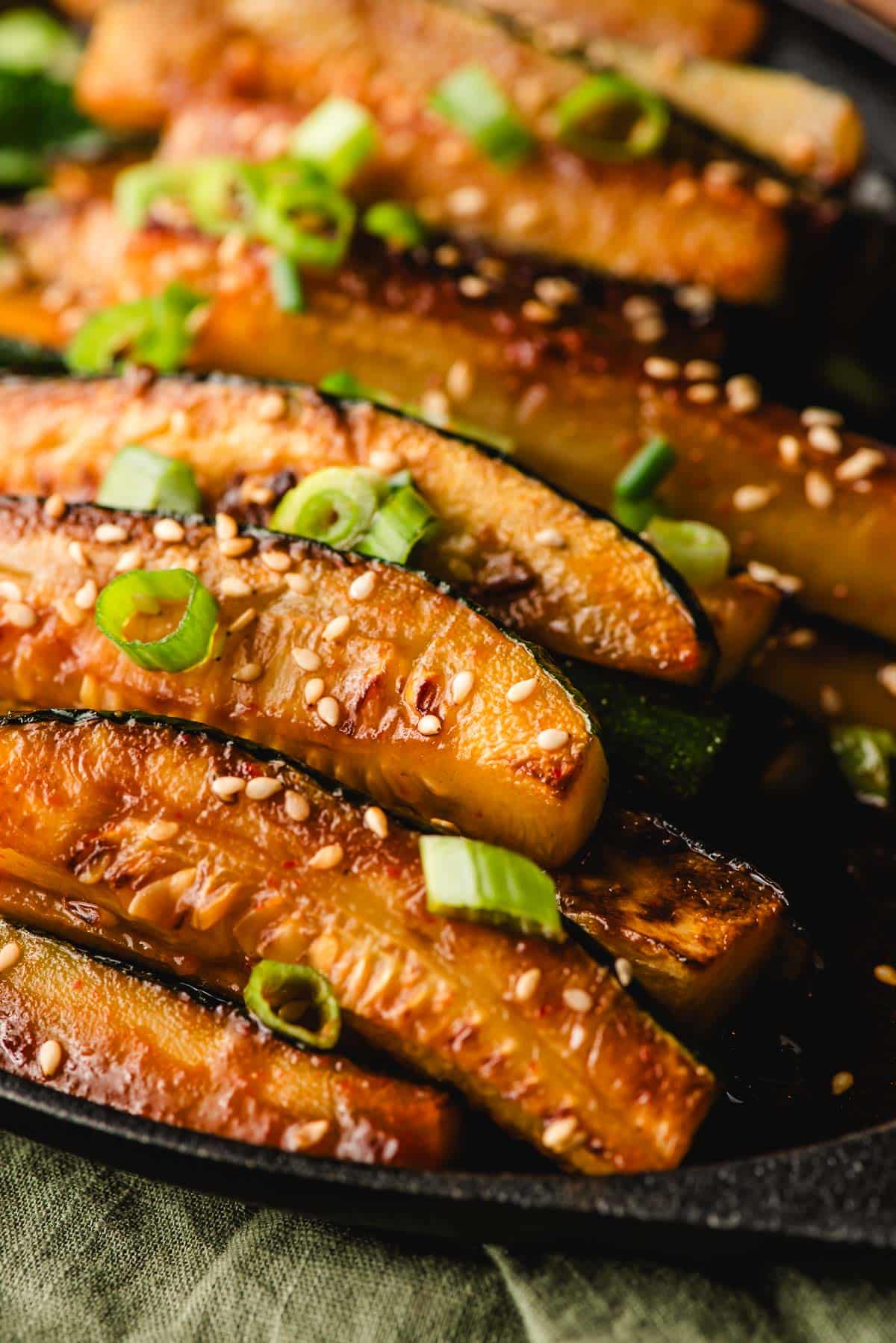Spicy zucchini spears with a soy and sriracha sauce.
