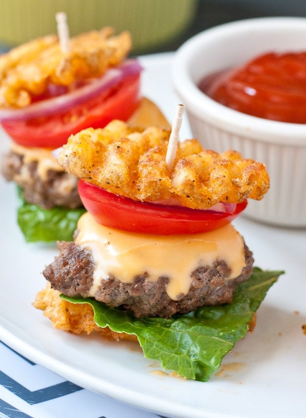 Mini burger sliders sandwiched between two waffle fries! A great party app or weeknight dinner!