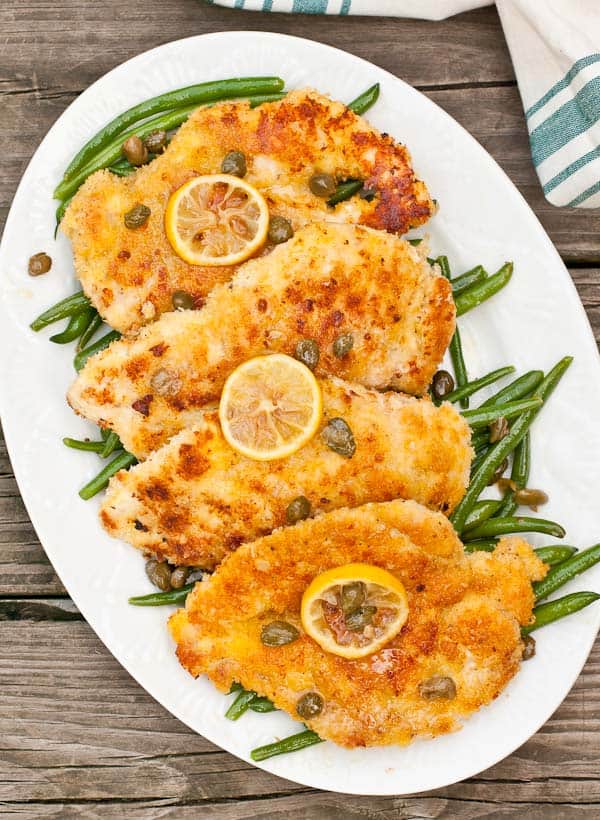 Crunchy Panko Crusted Chicken Piccata gets dressed in a dreamy lemon butter sauce.
