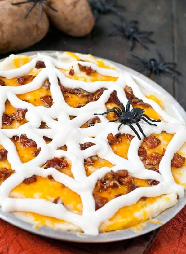 Loaded with cheese, bacon, and sour cream this Mashed Potato Spider Web Casserole is a special Halloween treat!