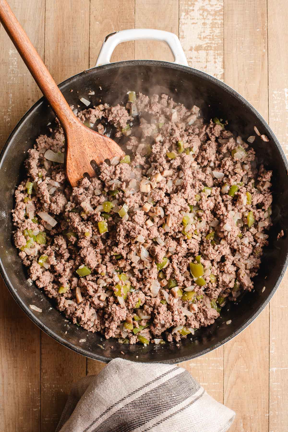 Sauteed ground beef and veggies in large skillet.