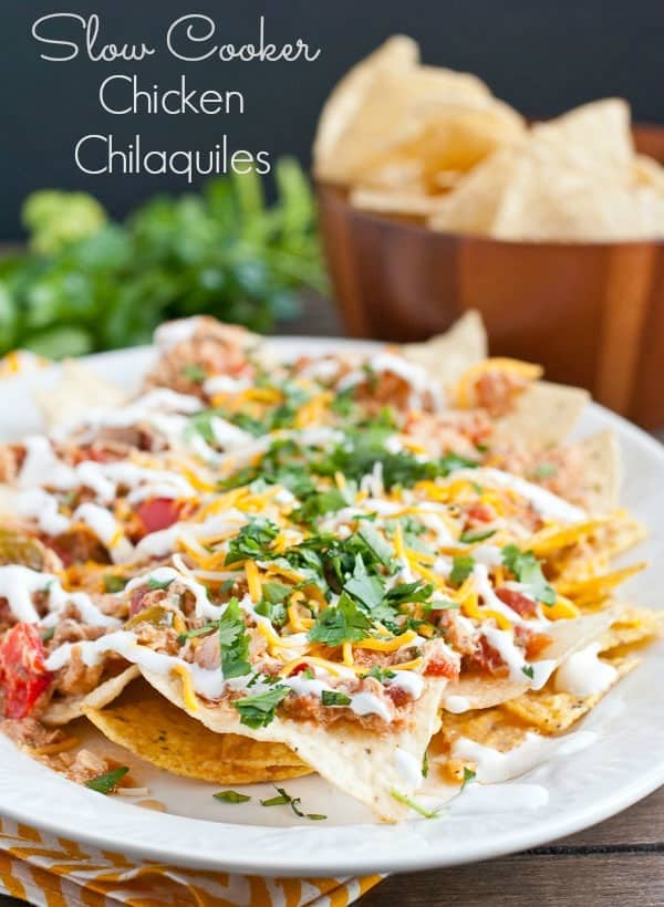 These Slow Cooker Chicken Chilaquiles are so easy to make and feed a crowd! Perfect for game day!