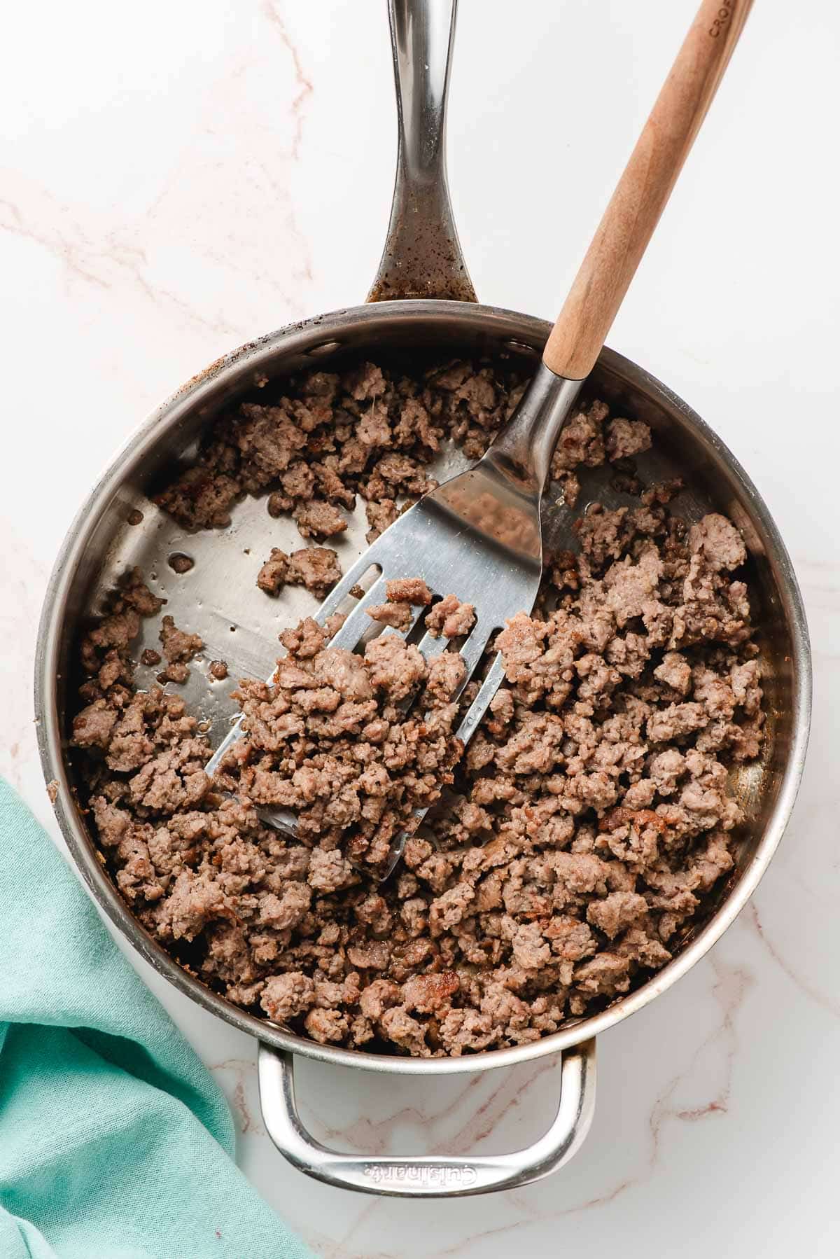 Browned sausage in a skillet.