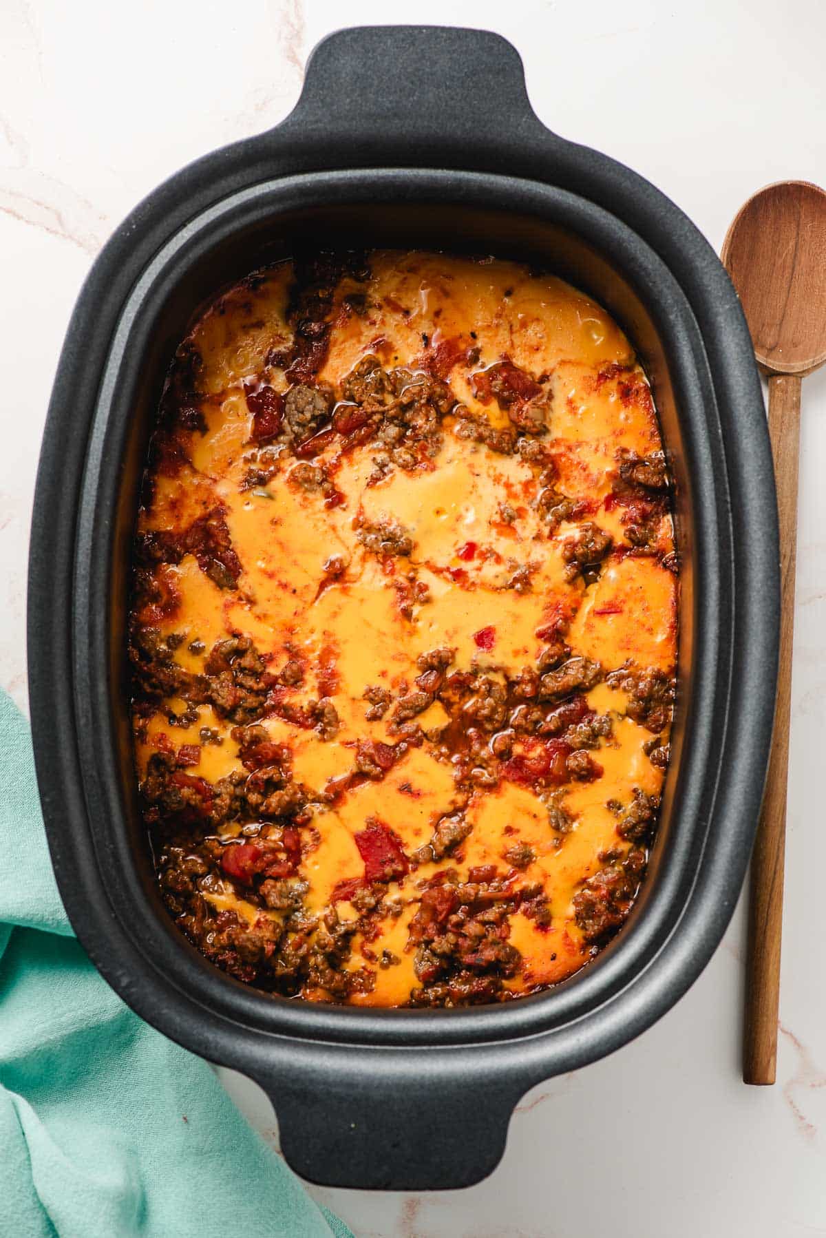 Melted velveeta, sausage, and salsa in a crock pot.