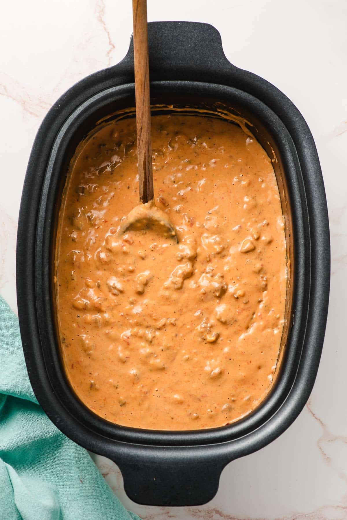 Crock pot full of velveeta sausage cheese dip.
