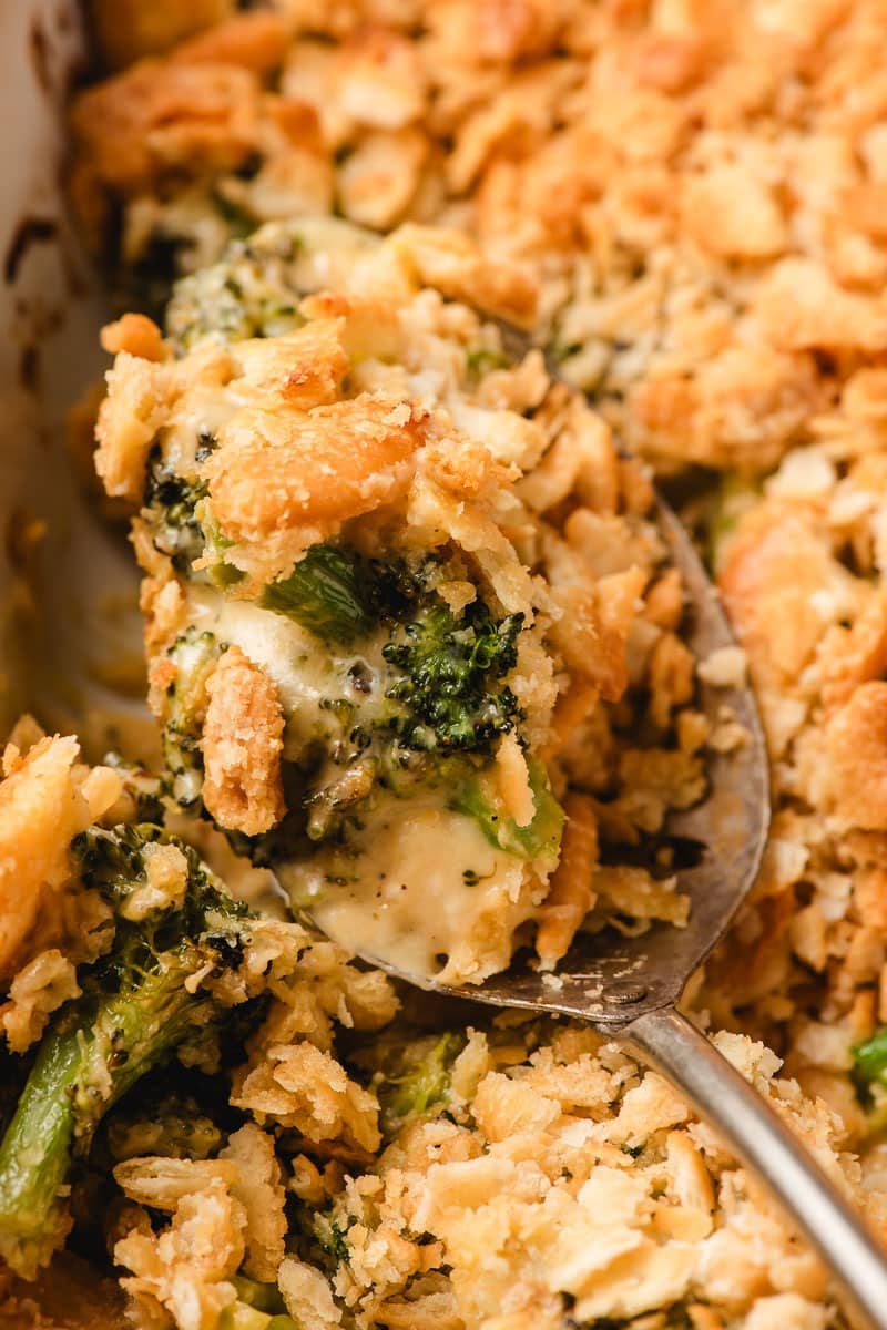 A scoop of Broccoli Ritz Casserole stuff lifted from the dish.