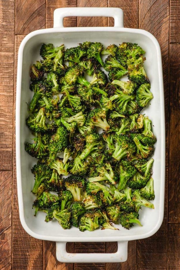 Roasted broccoli in a casserole dish.