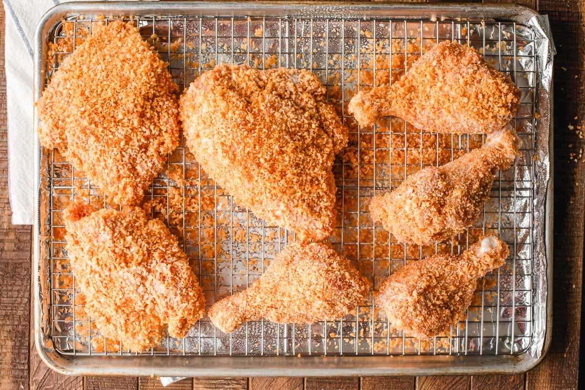 Panko crusted chicken on a sheet pan before being baked.