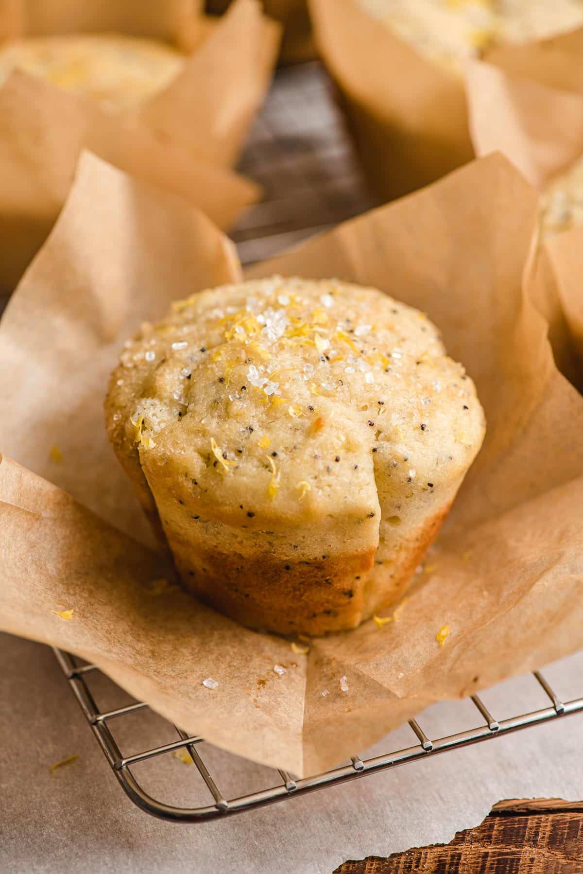 Lemon Raspberry Jam Muffin shown in a parchment paper wrapper.