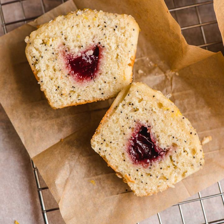 Sliced lemon raspberry muffin with jam in the middle.