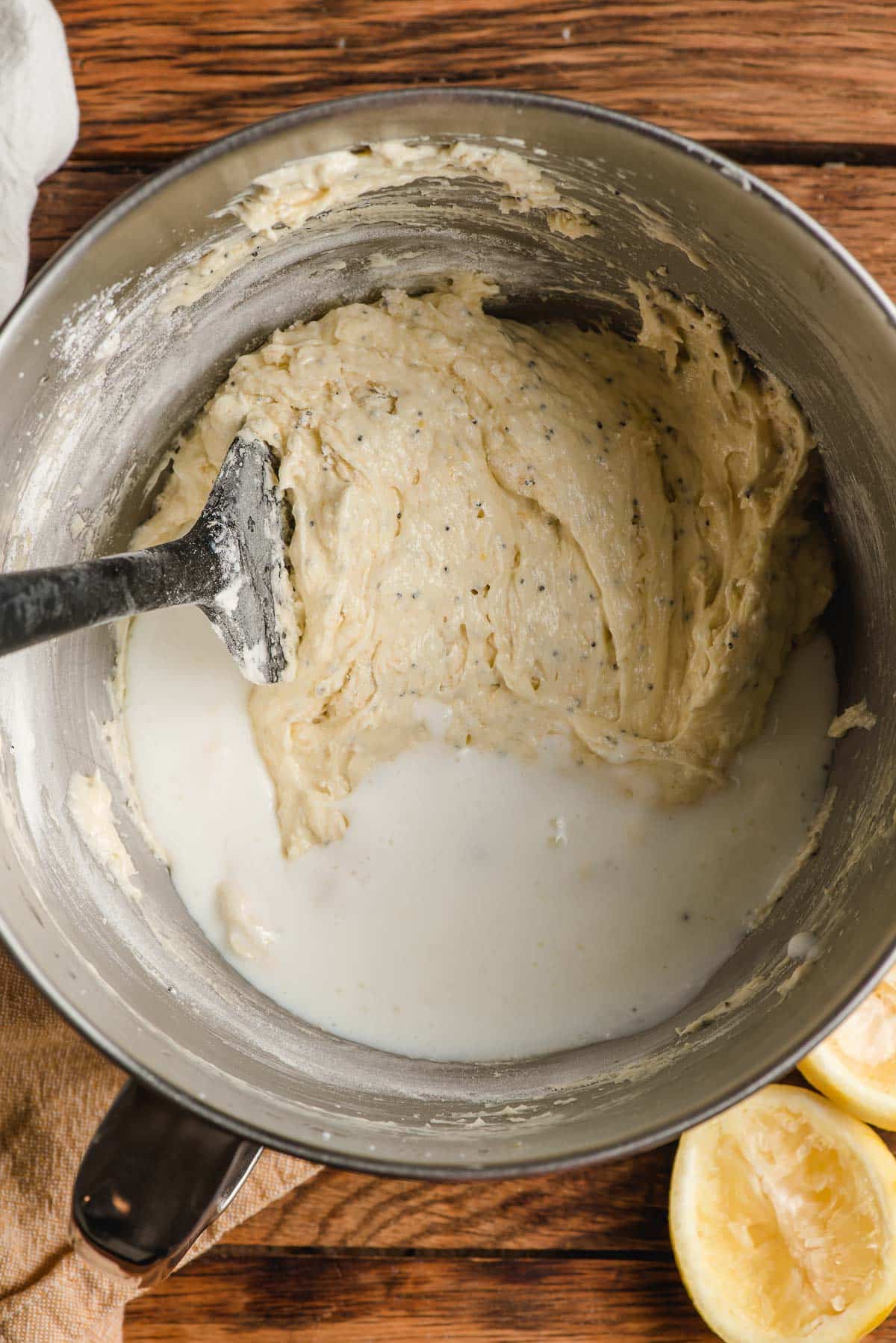 Buttermilk being stirred into muffin batter.