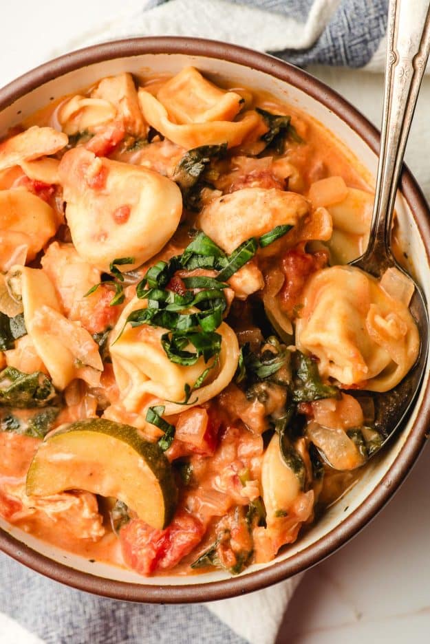 Chicken sausage soup with tortellini and zucchini.