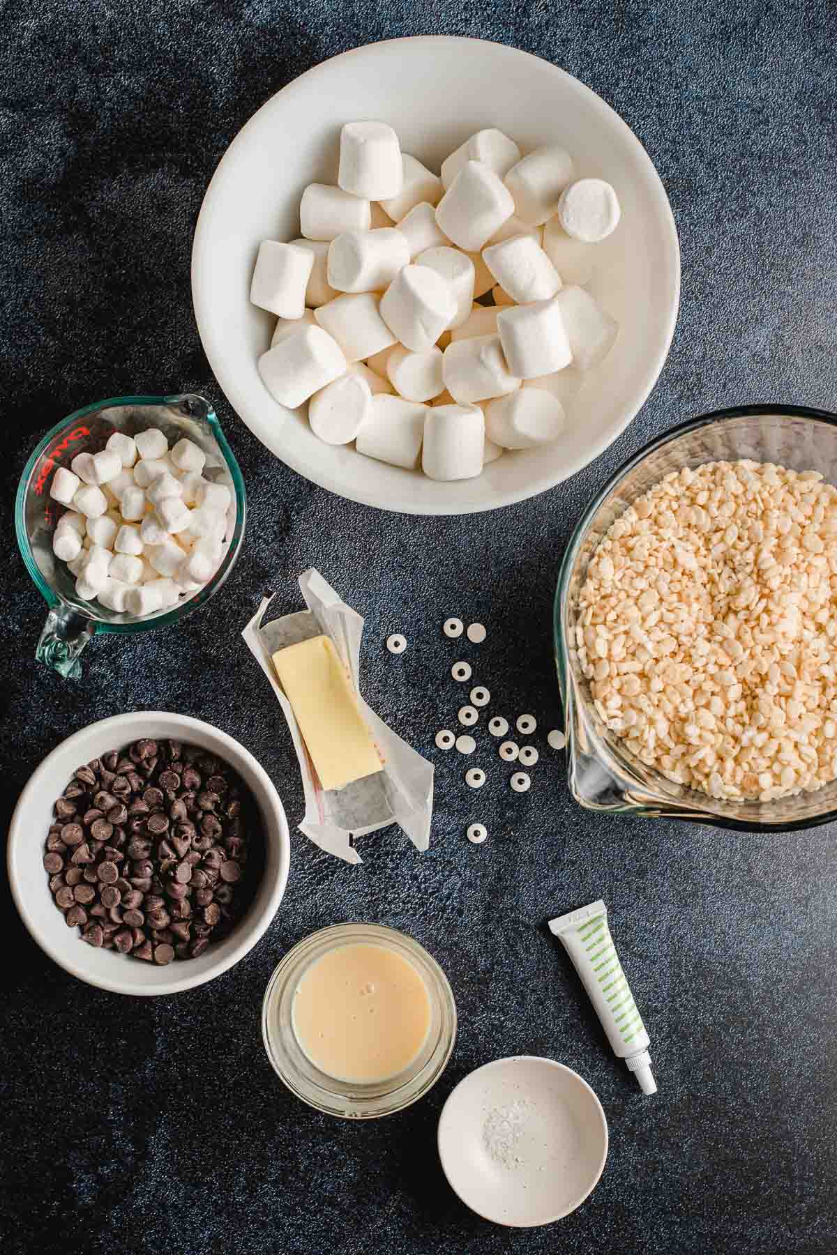 Ingredients for rice krispie treats on a black background.