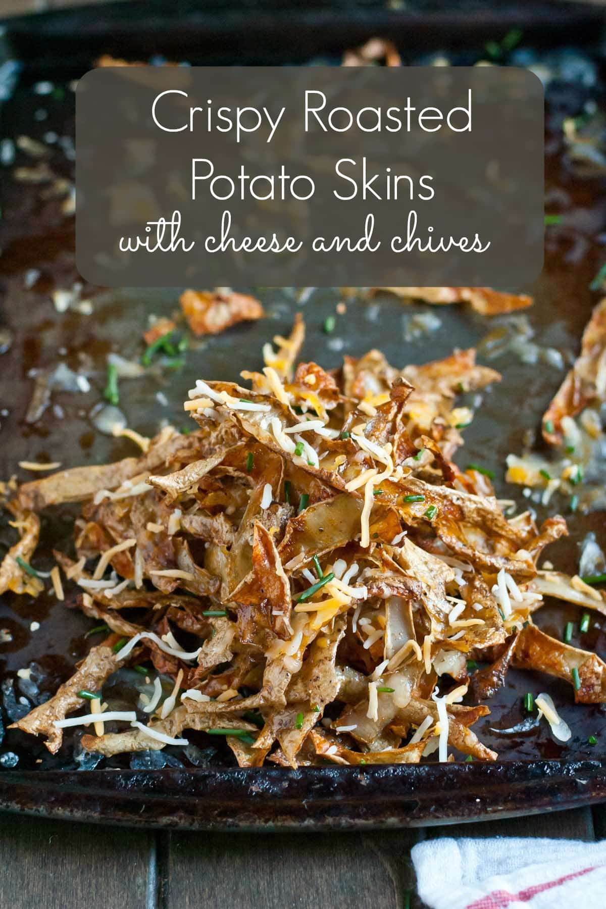 Never throw away potato peels again! These Crispy Roasted Potato Skins with cheese and chives are the perfect snack!