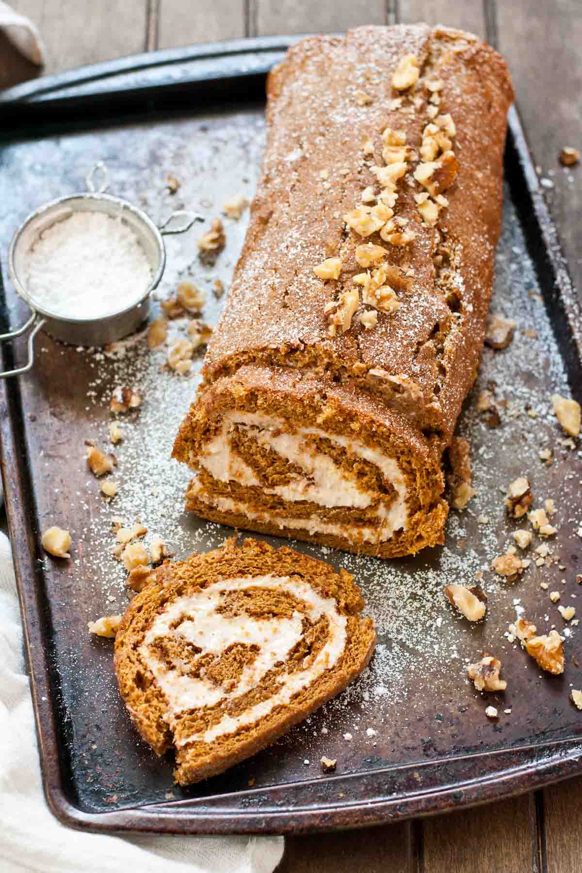 This Gingerbread Cake Roll is the perfect dessert for Thanksgiving or Christmas. It's easy to make ahead of time and freeze!