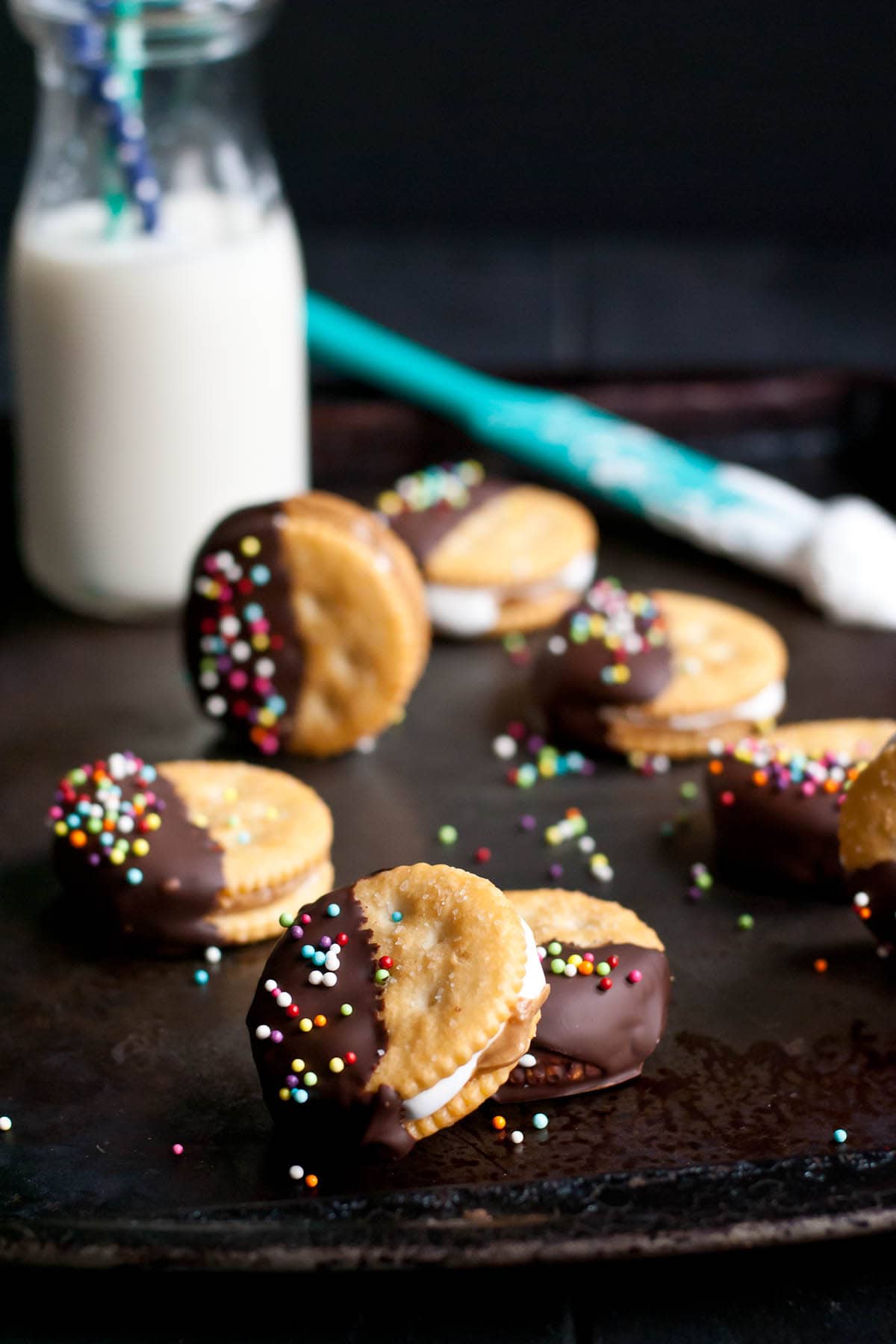 Four ingredients is all you need to make these addictive Chocolate Dipped Fluffernutter Ritz Cookies!