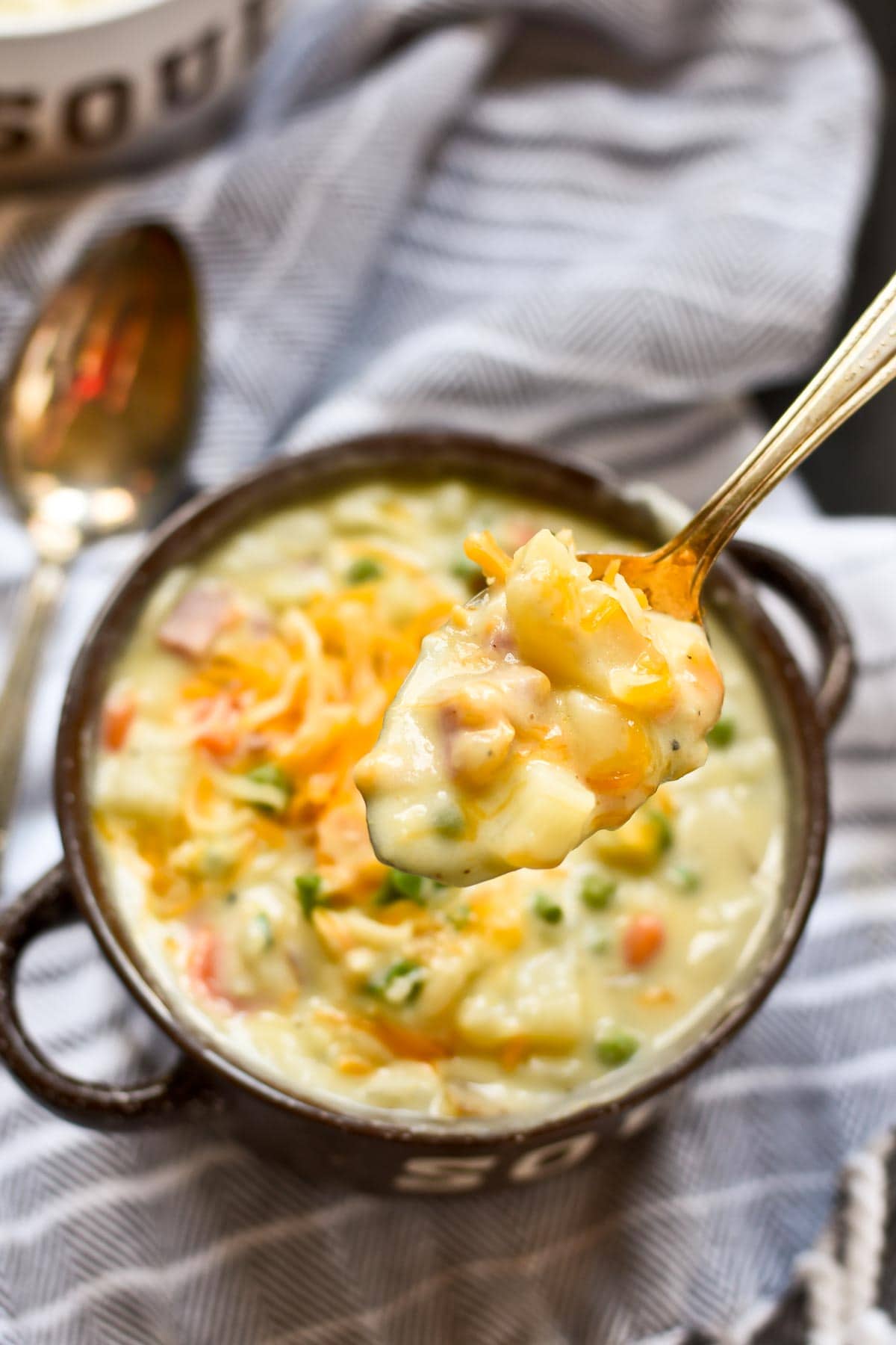 Every bite of this Creamy Ham and Potato Soup is loaded with hunks of ham, potato, chives, and cheese!