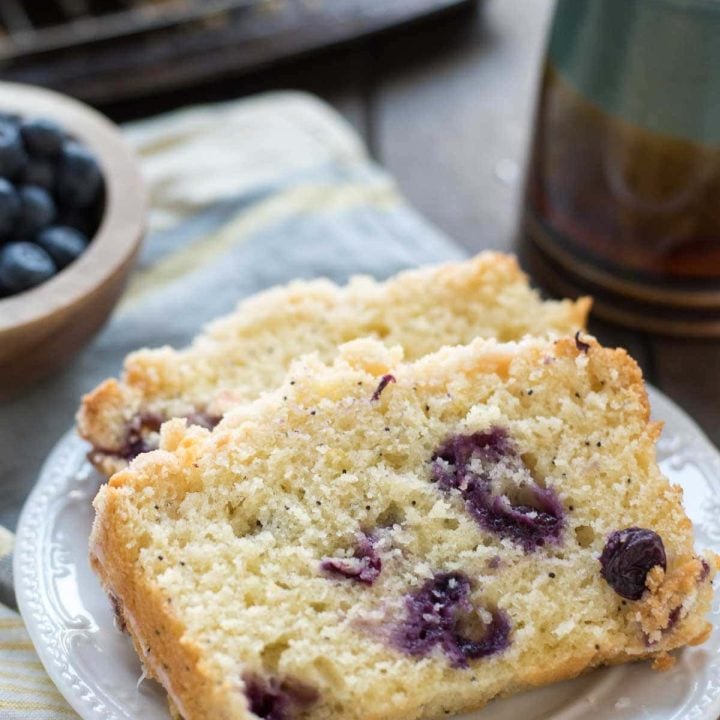 This Lemon Blueberry Bread is tangy and sweet with a perfect crumb topping and lemon glaze.