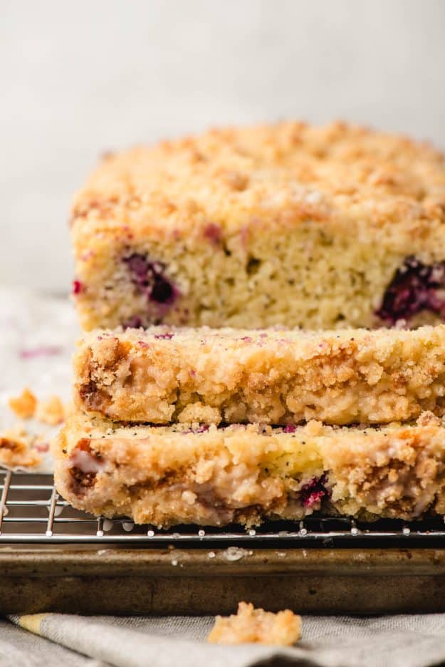 Two slices of lemon blueberry bread with crumb topping.