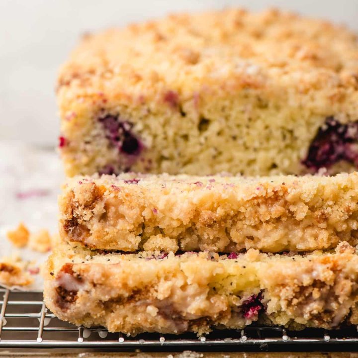Two slices of lemon blueberry bread with crumb topping.