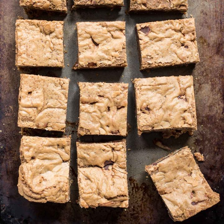 Weather sheet pan with square slices of brown butter blondies on top.