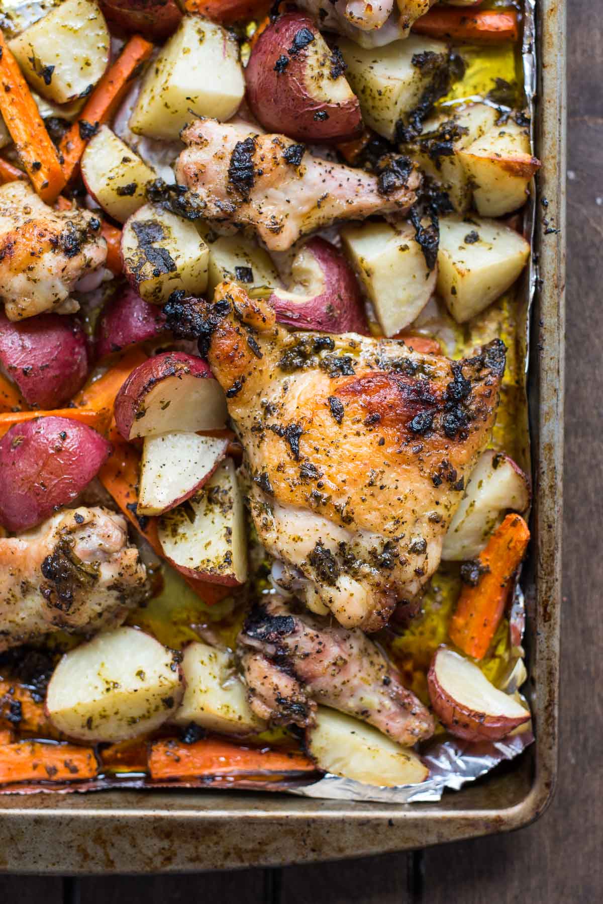 This killer Sheet Pan Pesto Chicken with Potatoes and Carrots is such a delicious, easy meal for a busy weeknight dinner.
